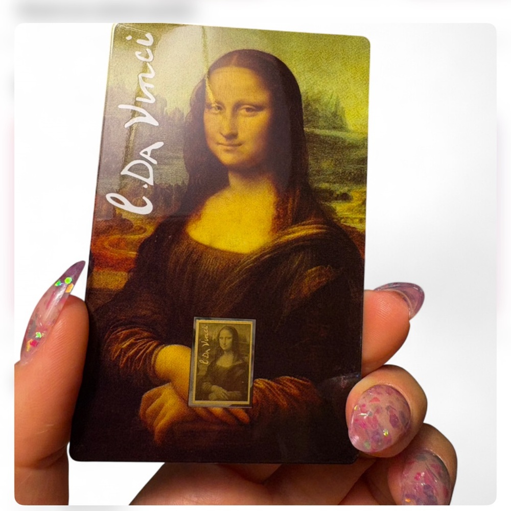Mona Lisa 1/1000 oz gold weight collectible piece of solid gold in packet sleeve